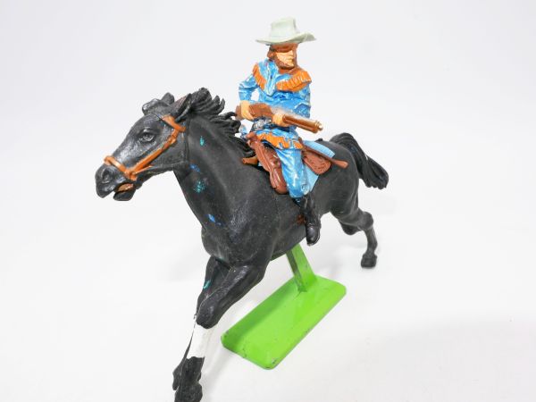 Britains Deetail Cowboy on horseback, rifle in front of the body