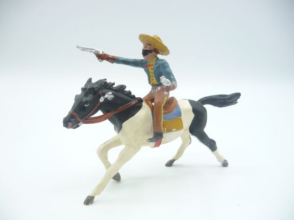 Merten Bandit riding, firing 2 pistols - great early figure
