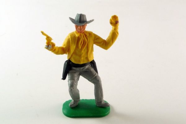 Timpo Toys Cowboy 1. Version Pistole/Hand erhoben, dunkelgelb