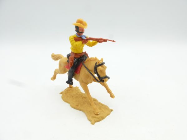 Timpo Toys Cowboy 3. Version reitend, Gewehr schießend