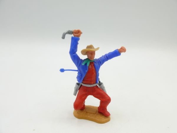 Timpo Toys Cowboy 2. Version hockend, von Pfeil getroffen (mittelblaue Jacke, rotes Hemd)