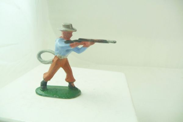 Starlux Cowboy standing, firing with rifle, presumably Jim (similar to Starlux)