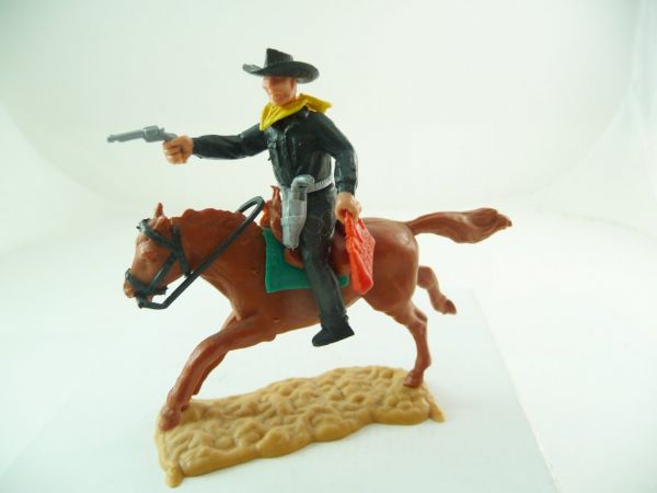 Timpo Toys Cowboy 2. version riding with pistol + moneybag