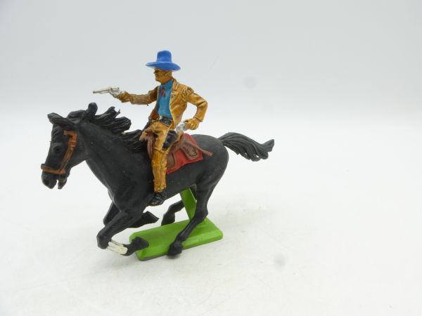 Britains Deetail Cowboy riding, 1 pistol shooting, 1 pistol pulling