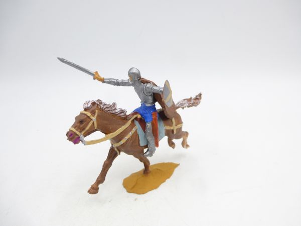 Knight riding thrusting with sword + cape