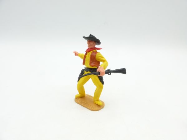 Timpo Toys Cowboy stehend mit schwarzem Gewehr, zeigend