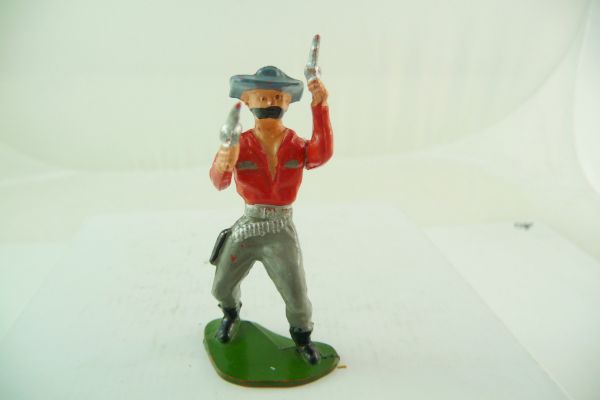 Reisler hard plastic Cowboy disguised, firing with 2 pistols - early, great figure
