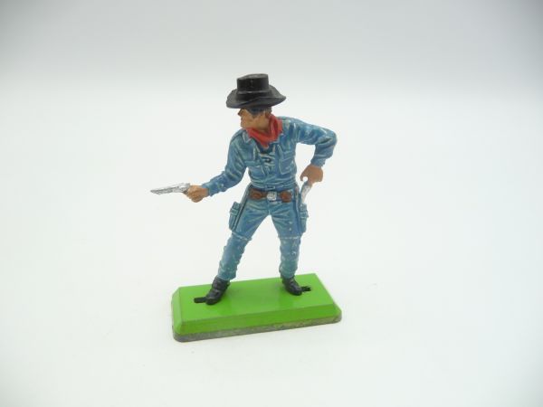 Britains Deetail Cowboy standing, firing / pulling pistol (medium blue)