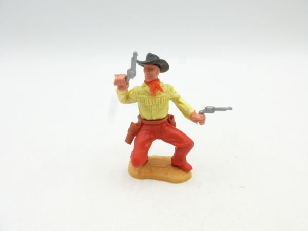 Timpo Toys Cowboy 2nd version crouching, firing wildly with 2 pistols