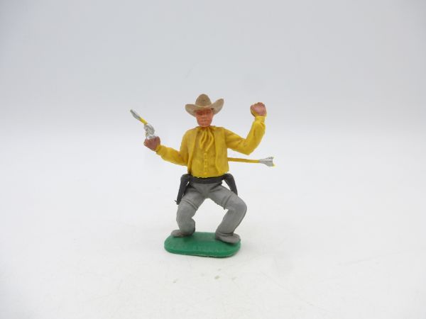 Timpo Toys Cowboy 1. Version, gelb, von Pfeil getroffen