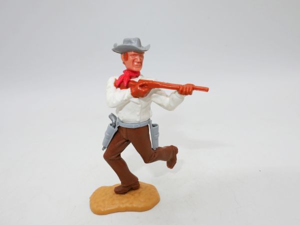 Timpo Toys Cowboy 2nd version running with short rifle + pistol in belt