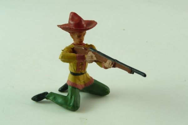 Merten Cowboy kneeling, firing with rifle