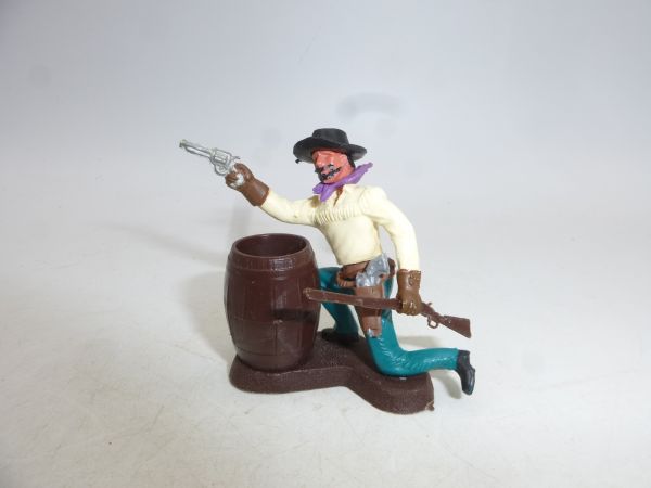Britains Swoppets Cowboy kneeling behind barrel with pistol + rifle