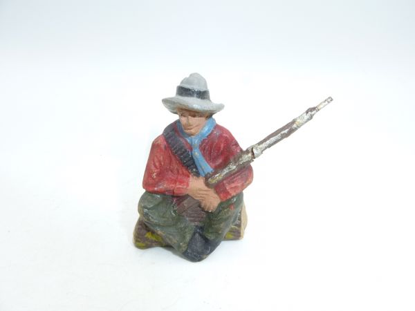 Pfeiffer Cowboy sitting with rifle - crack on back of rifle