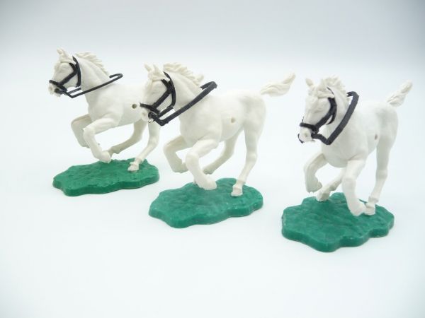 Timpo Toys 3 Pferde kurz galoppierend, weiß-schwarzes Zaumzeug
