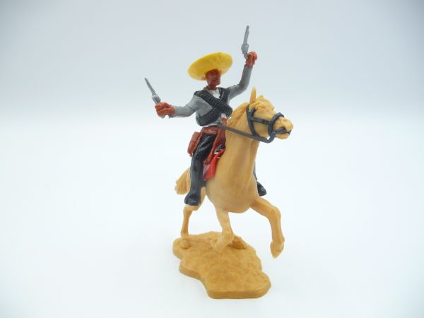 Timpo Toys Mexican on horseback, firing wild with 2 pistols, grey/black belt
