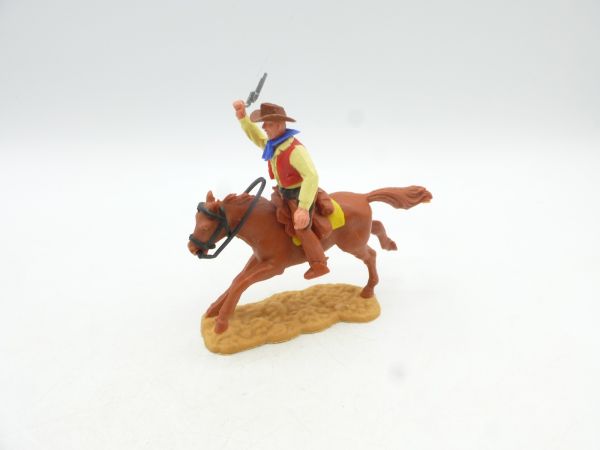 Timpo Toys Cowboy 2. Version reitend mit Pistole in die Luft schießend