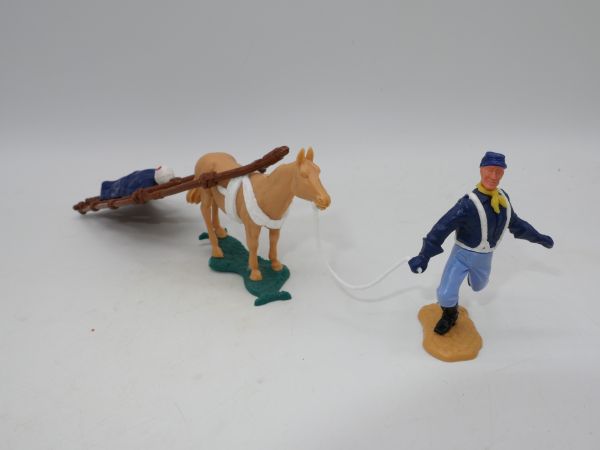 Timpo Toys Northerner with wounded man on stretcher, dark blue blanket