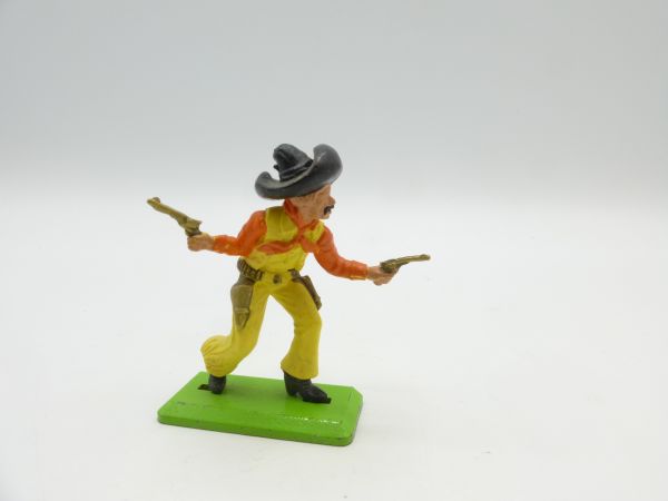 Britains Deetail Mexican going forward with 2 pistols, yellow/orange