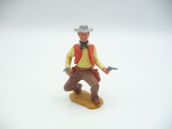 Timpo Toys Cowboy 3. Version hockend mit 2 Pistolen