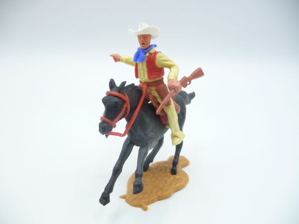 Timpo Toys Cowboy 2. Version reitend mit Gewehr, zeigend, weißer Hut