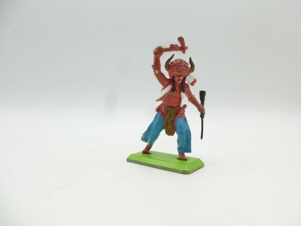 Britains Deetail Medicine man with tomahawk + rifle, blue trousers
