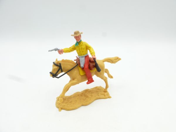 Timpo Toys Cowboy 3. Version reitend mit Pistole + Geldtasche