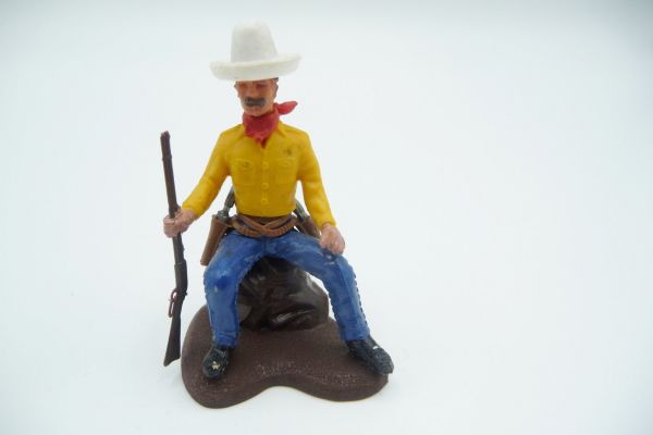 Britains Swoppets Cowboy sitting on stone