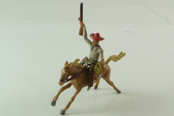 Merten Cowboy mounted, holding up rifle