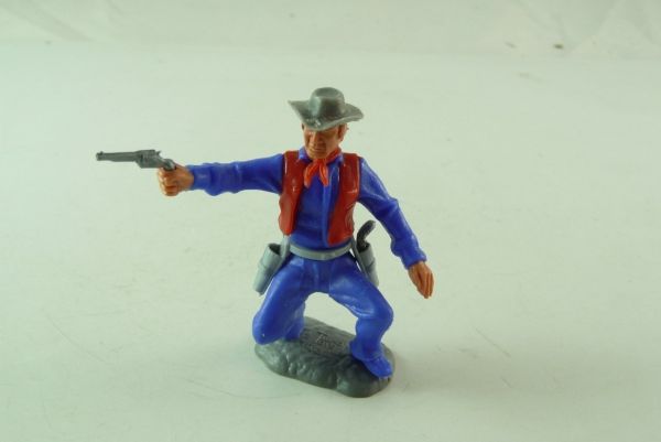 Timpo Toys Cowboy stehend, Pistole schießend, mittelblau/rot - selten