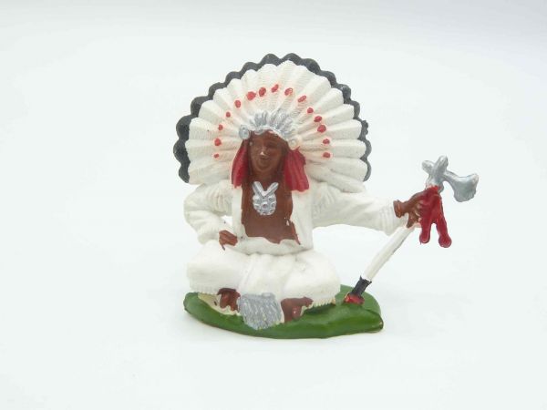 Britains Swoppets Chief sitting with tomahawk, feathers with red