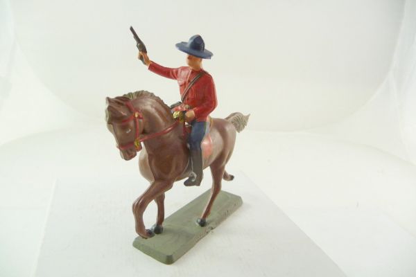 Starlux Mountie riding, firing with pistol in the air