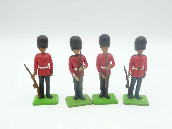 Britains Deetail 4 guardsmen standing, presenting rifle, at the side