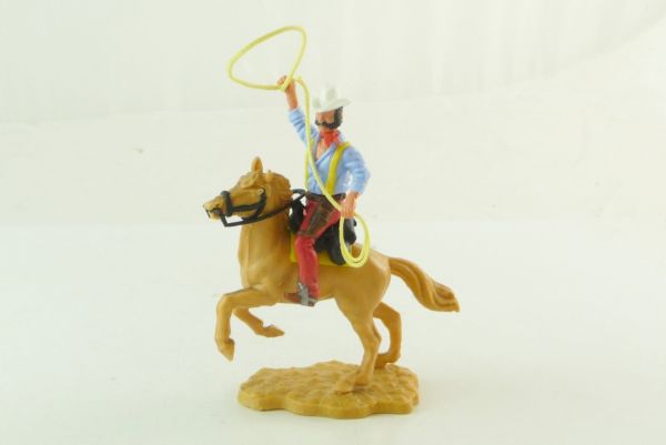 Timpo Toys Cowboy 4th version riding with lasso on rare red lower part