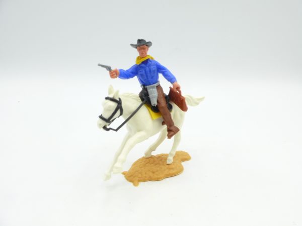 Timpo Toys Cowboy reitend mit Pistole + Geldtasche