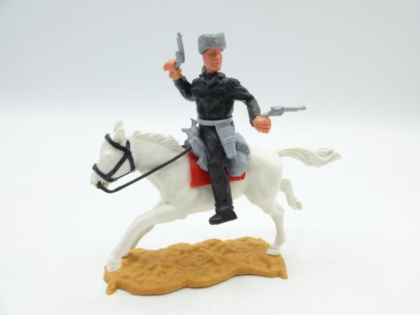Timpo Toys Trapper on horseback, firing wild with 2 pistols - great colour combination