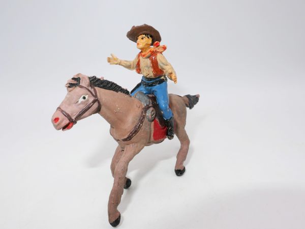 Jescan Cowboy on horseback, arms outstretched