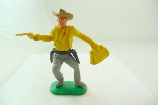 Timpo Toys Cowboy 1. Version stehend mit Pistole + Geldtasche, dunkelgelb