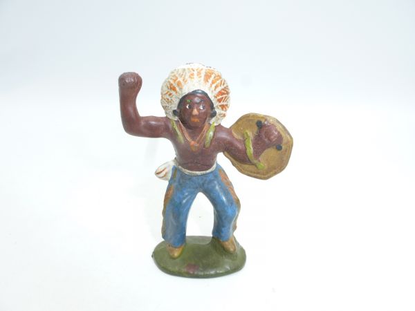 Indian standing with shield, fist raised