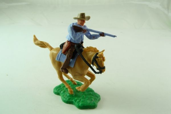 Timpo Toys Cowboy 1. Version (kleiner Hut), reitend, Gewehr schießend