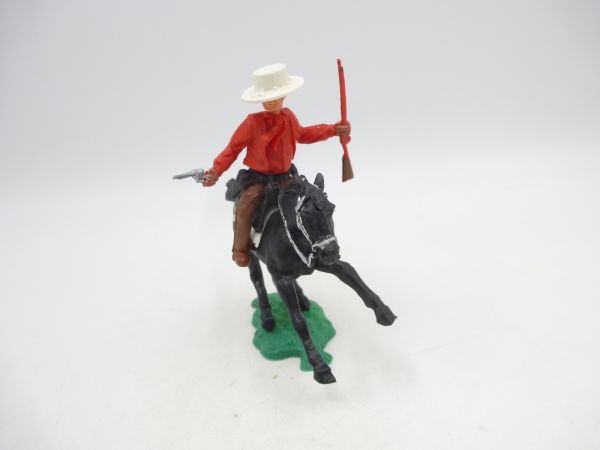 Timpo Toys Cowboy 1. Version reitend mit Pistole + Gewehr