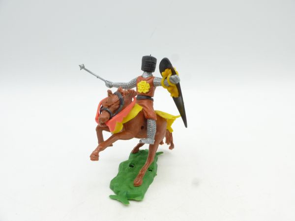 Medieval knight riding with morning star, brown