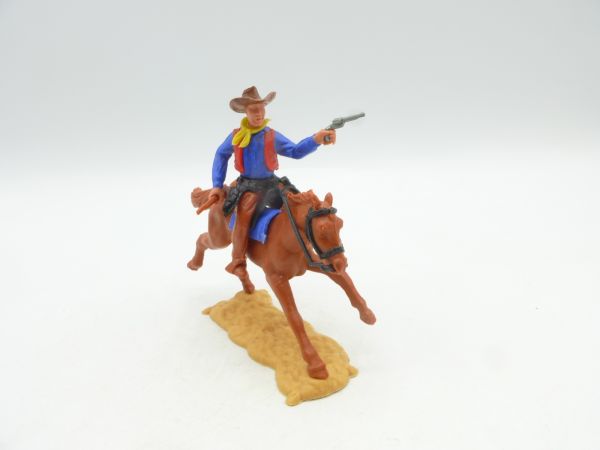 Timpo Toys Cowboy reitend mit Pistole und Gewehr