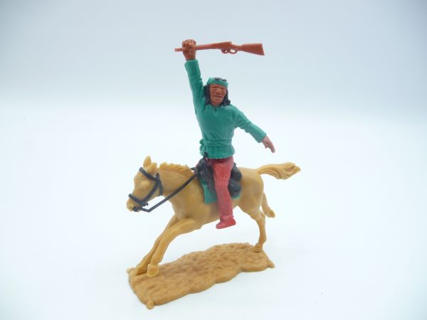 Timpo Toys Apache riding dark green, holding rifle over head
