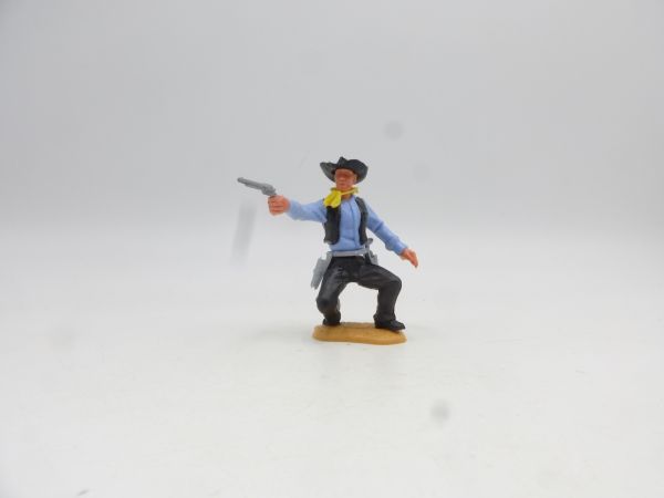 Timpo Toys Cowboy 2. Version hockend Pistole schießend