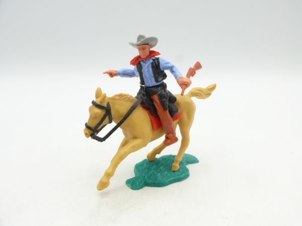 Timpo Toys Cowboy reitend mit Gewehr, zeigend