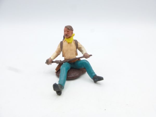 Britains Swoppets Cowboy sitting, rifle in front of body, without hat