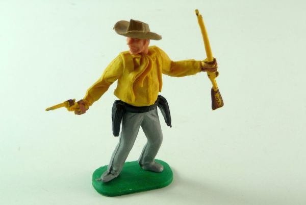 Timpo Toys Cowboy 1. Version stehend mit Pistole und Gewehr, dunkelgelb