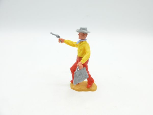 Timpo Toys Cowboy 3. Version (großer Kopf) vorgehend mit Pistole
