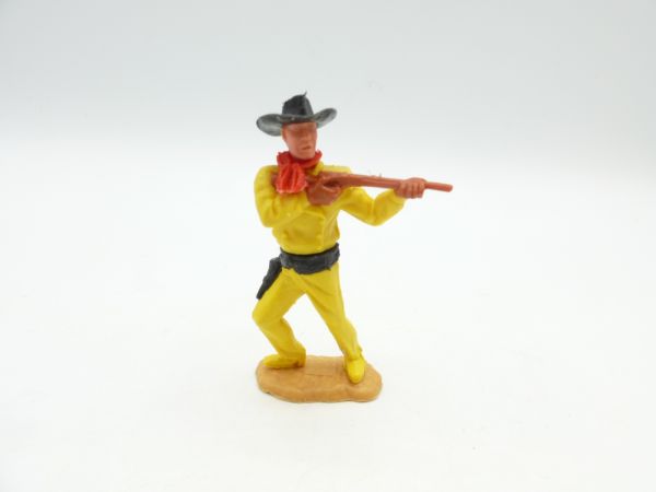 Timpo Toys Cowboy stehend, mit kurzem Gewehr schießend
